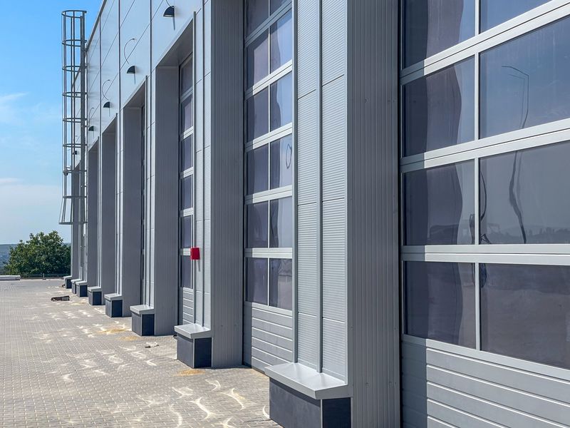 Row of large commercial window units on a grey building